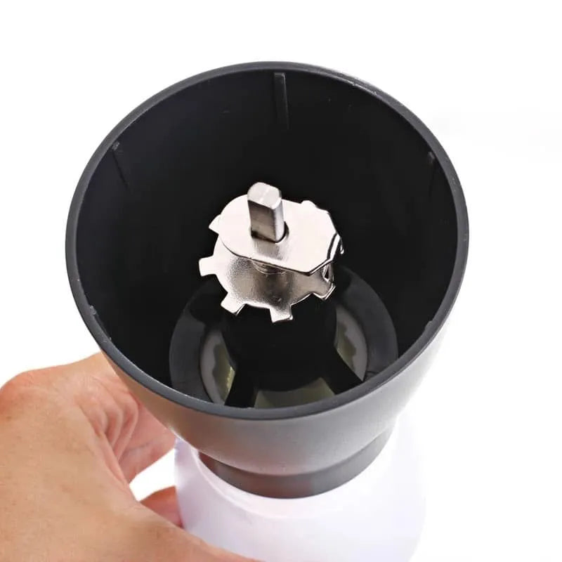 Gater manual ceramic burr coffee grinder in grey on a wooden surface