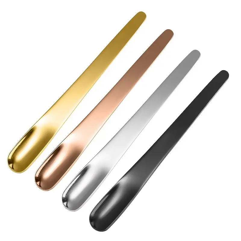 Four 410 Stainless Steel Espresso Spoons by Crop in matte black, silver, gold, and rose gold finishes.