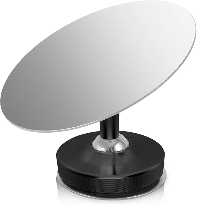 Crop Cafe espresso shot mirror with a reflective oval glass piece mounted on an adjustable black magnetic base.