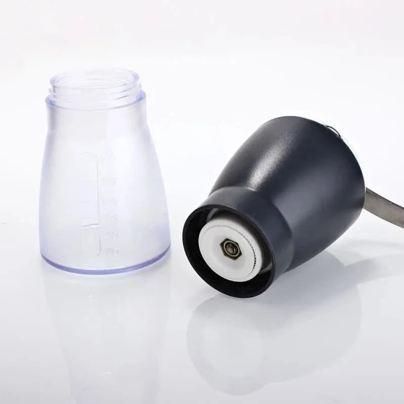Gater manual ceramic burr coffee grinder in grey on a wooden surface