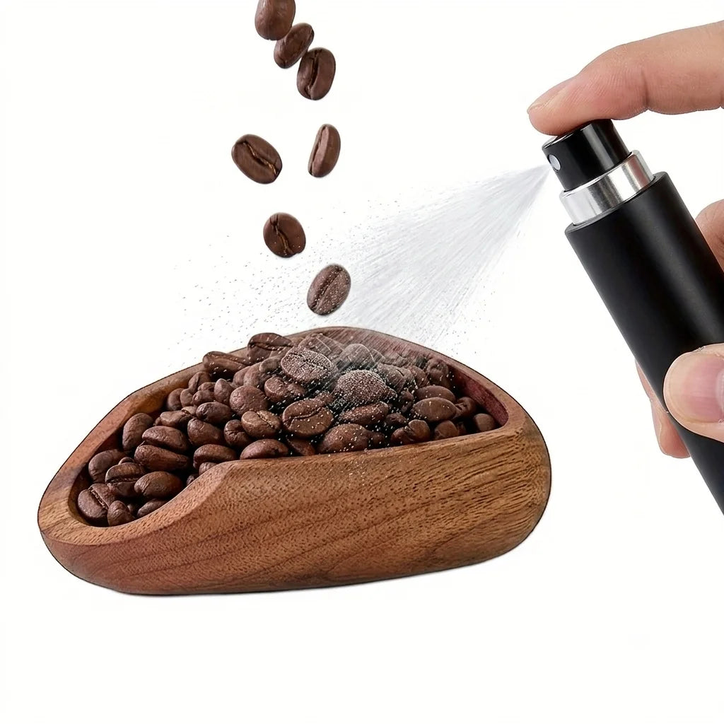 Crop Cafe RDT spray bottle with a minimalist matte black cylinder body and fine mist atomizer top nozzle.