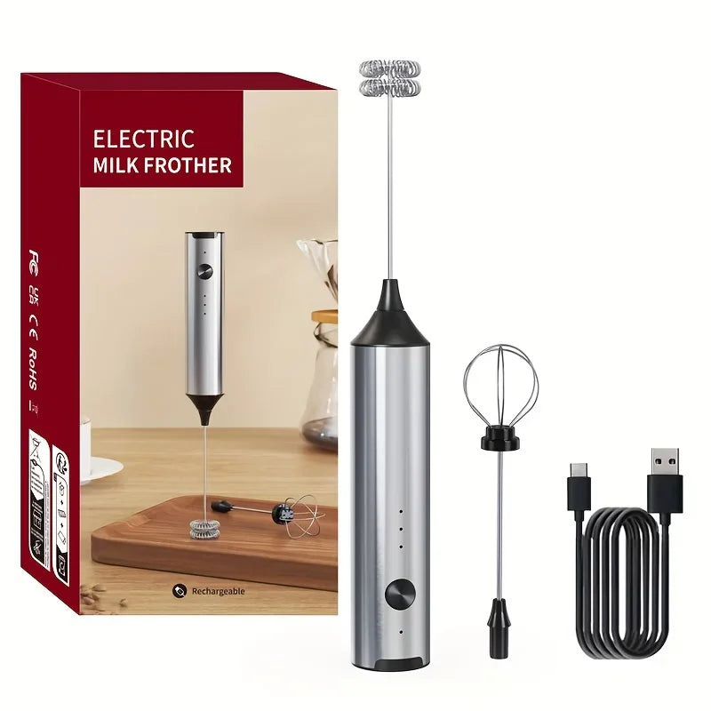 Crop Cafe electric milk frother wand resting on its sleek stainless steel countertop storage and charging stand.