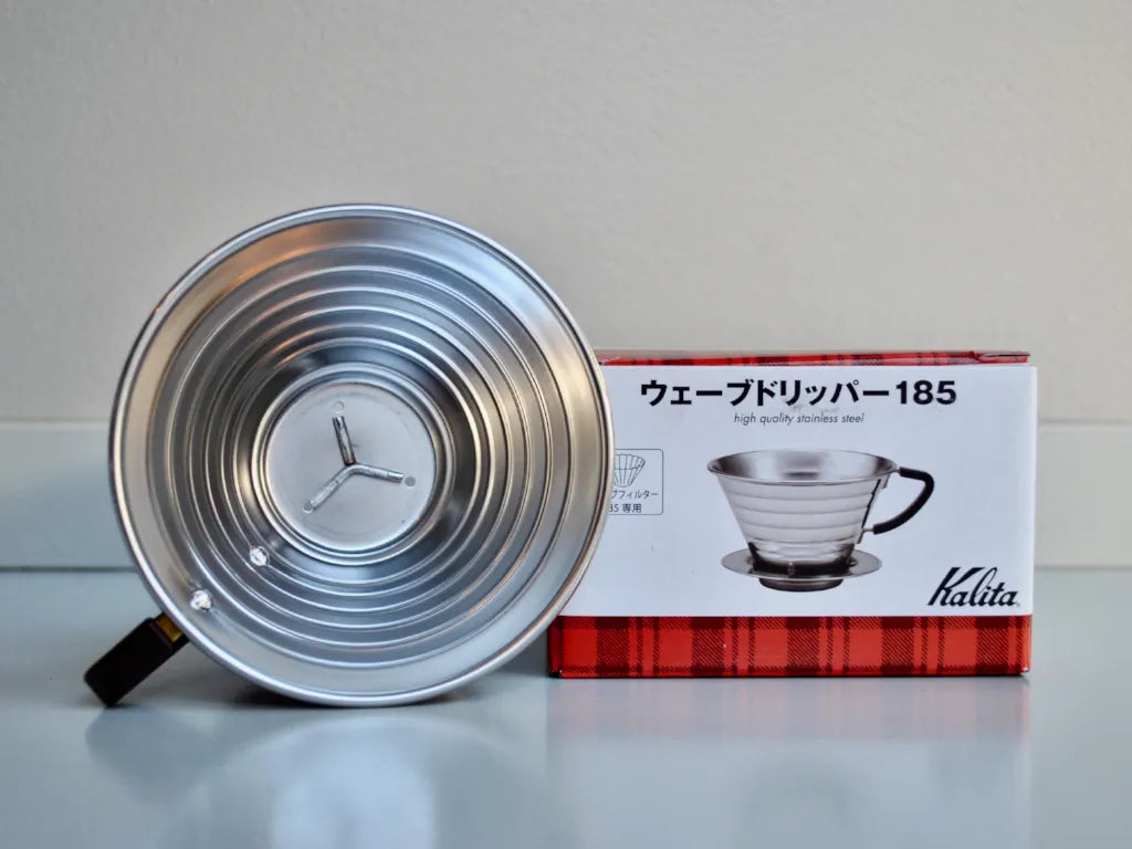 Kalita Wave 185 Stainless Steel Dripper brewing pour over coffee into a cup